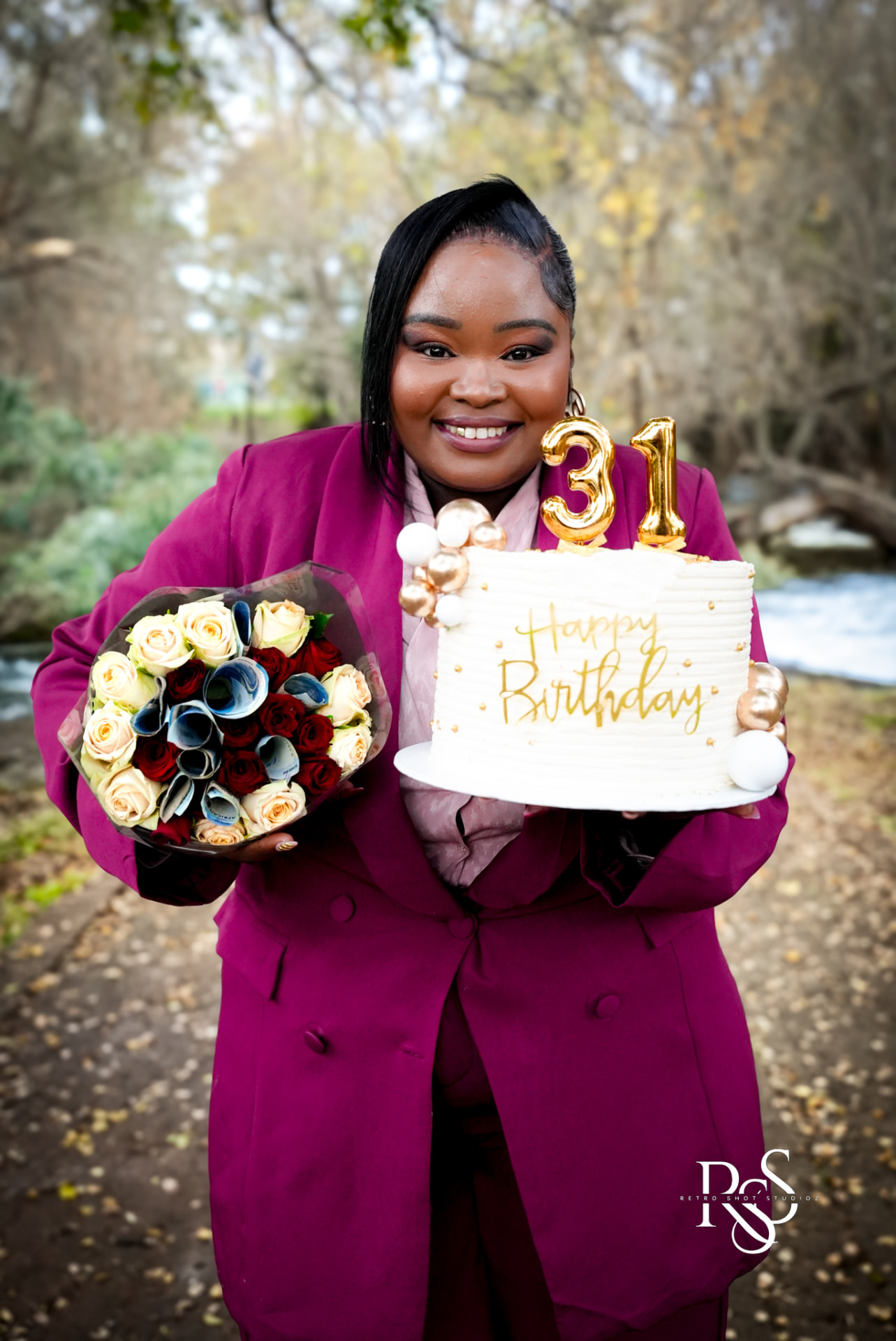 31st birthday portrait with cake and flowers